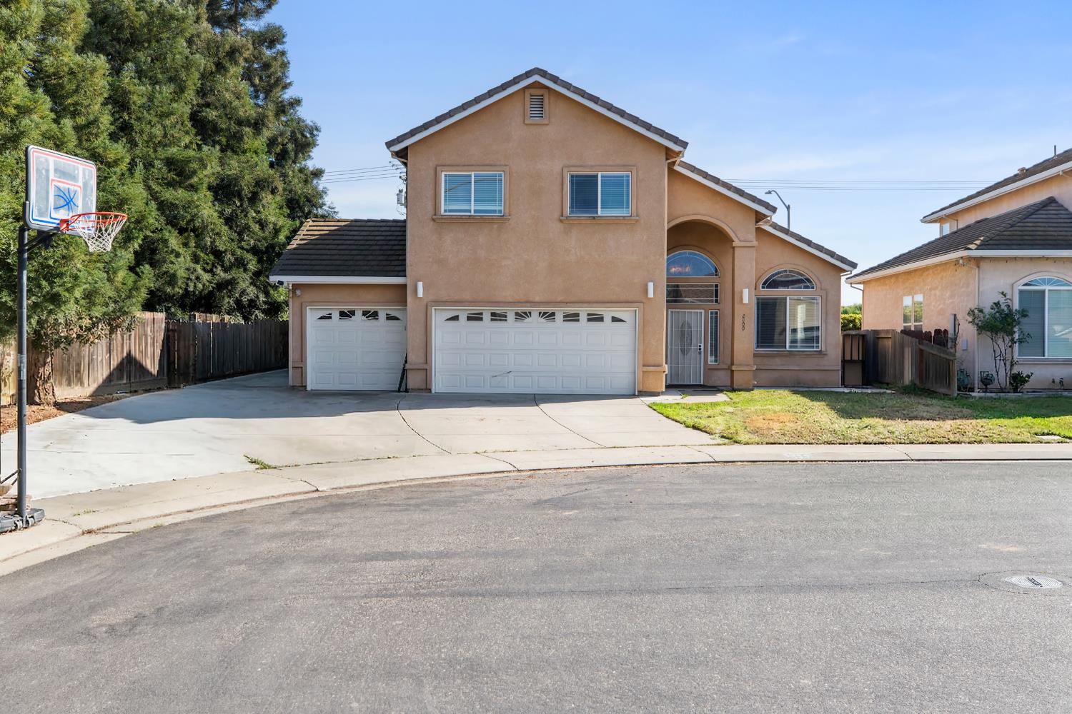2000 Nita Alexander Court Modesto, CA 95358 - Photo 1 of 33 a view of house with yard and large tree