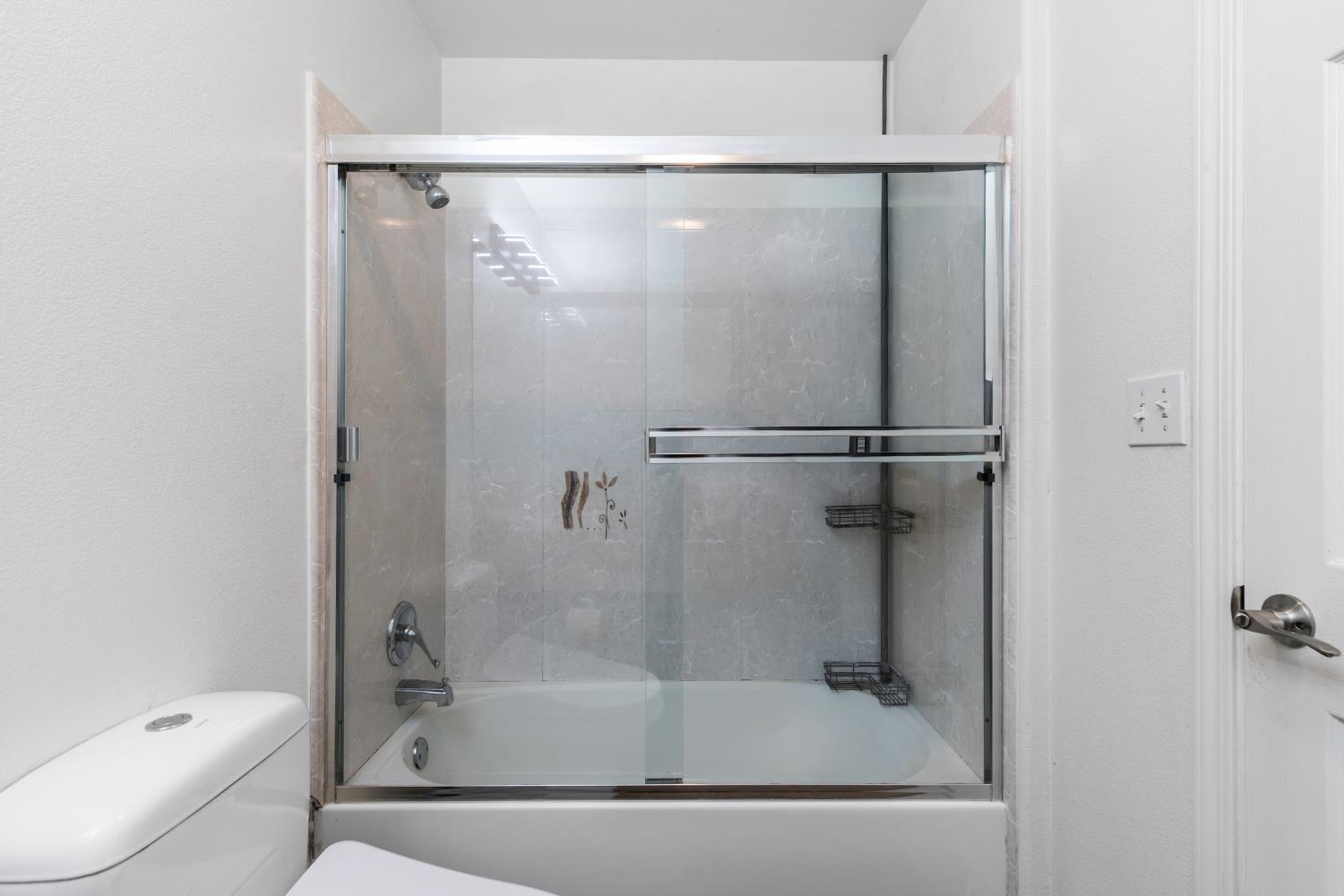 2000 Nita Alexander Court Modesto, CA 95358 - Photo 11 of 33 a bathroom with a shower and a toilet