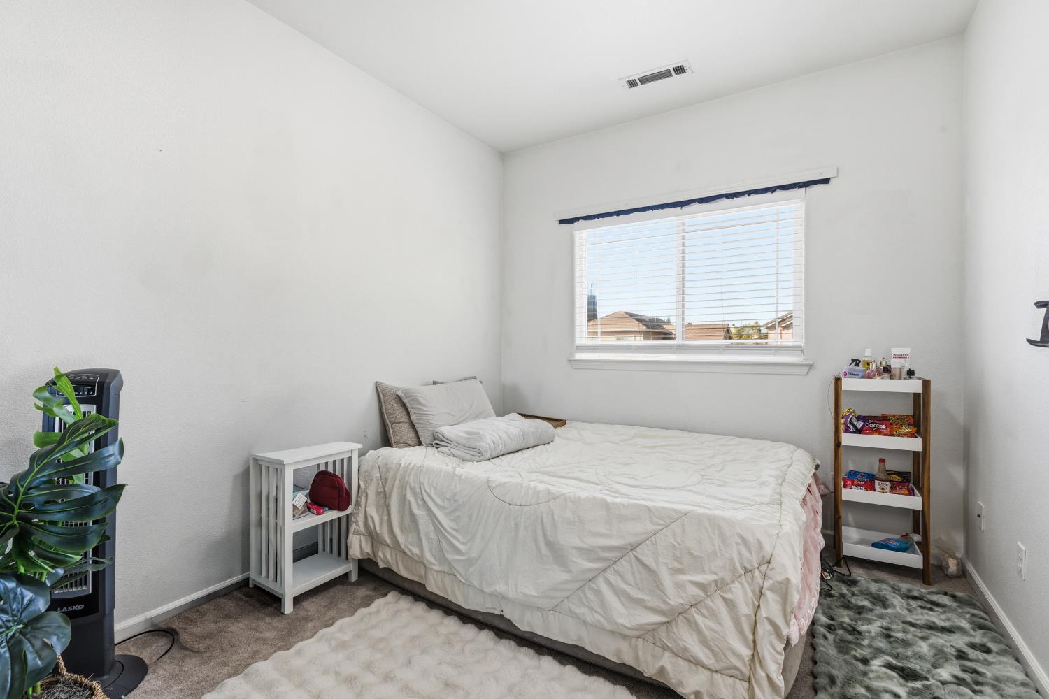 2000 Nita Alexander Court Modesto, CA 95358 - Photo 14 of 33 a bedroom with a bed and a window