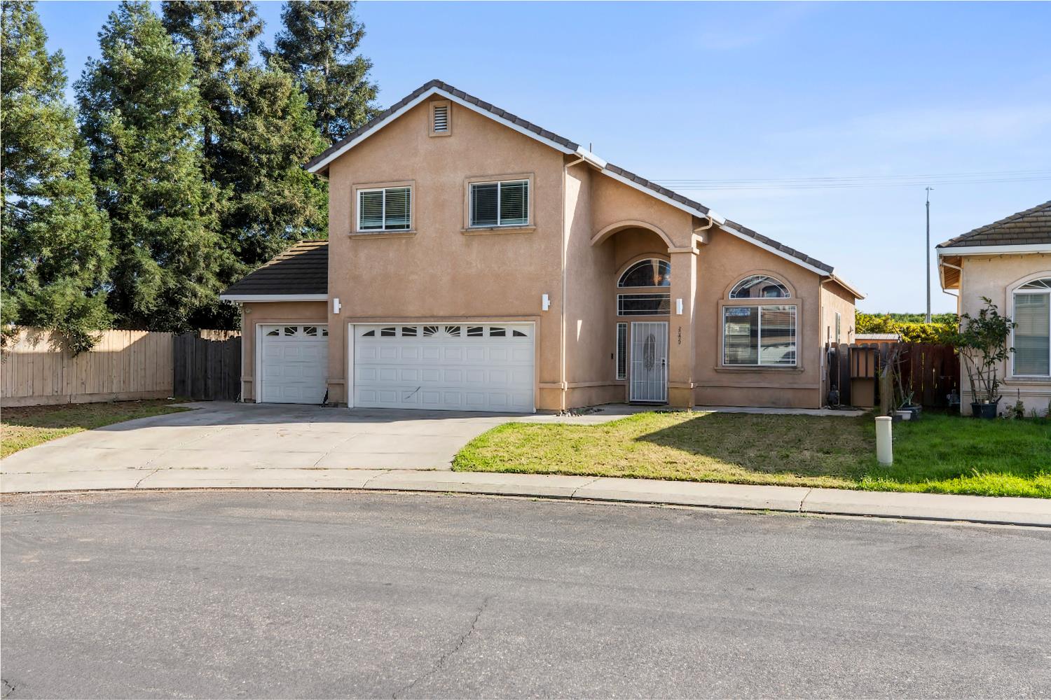 2000 Nita Alexander Court Modesto, CA 95358 - Photo 33 of 33 a front view of a house with a yard and garage