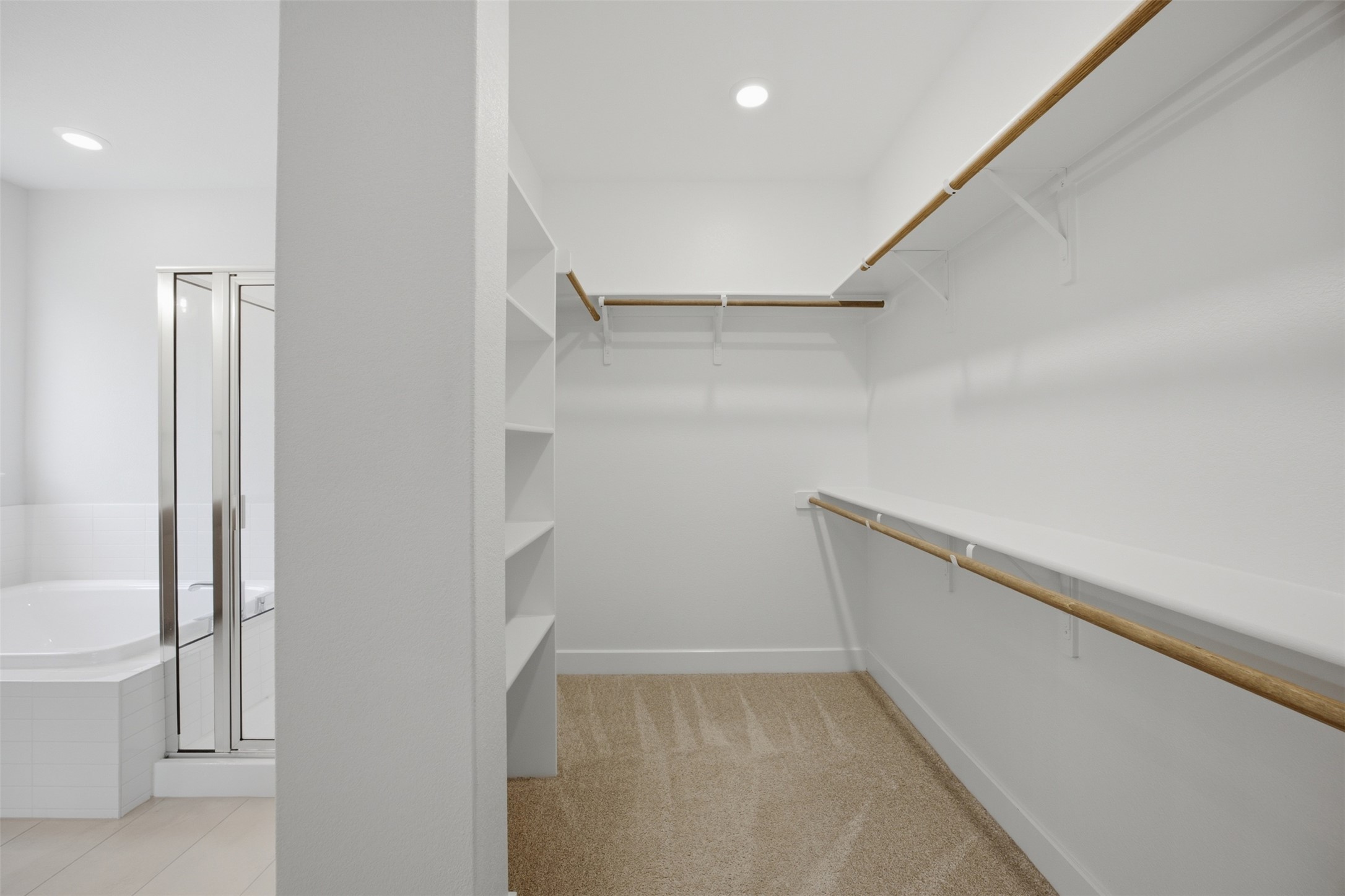 2101 Little Snake Way Georgetown, TX 78633 - Photo 24 of 37 Ample storage solutions await in this naturally illuminated primary walk-in closet, offering organized living.