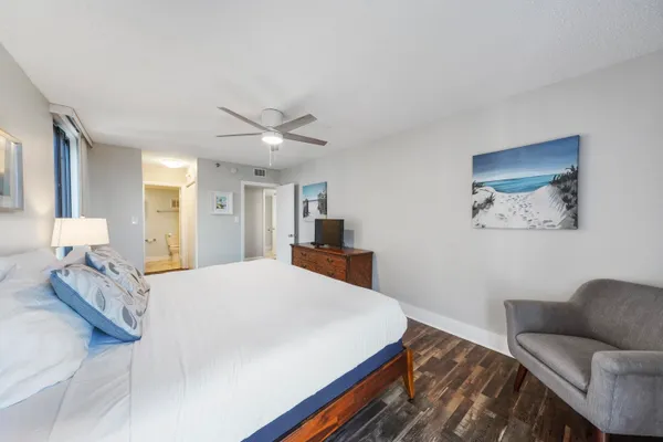 a bedroom with a bed and a couch