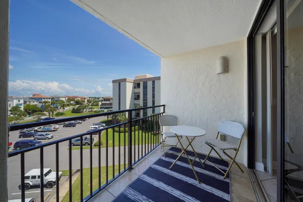 a view of a balcony with furniture