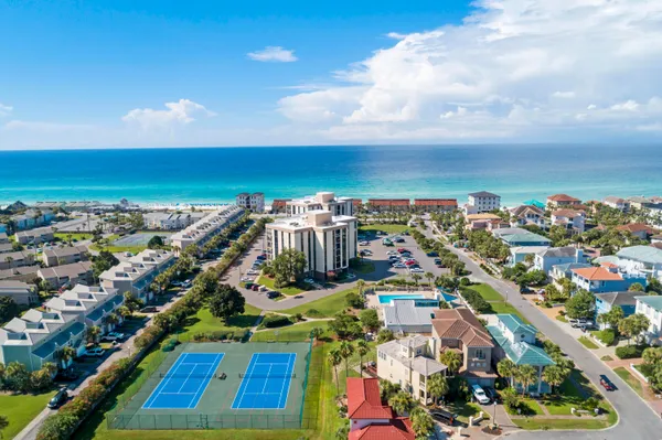 an aerial view of residential building and ocean