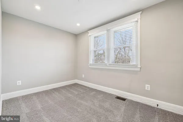 an empty room with closet area