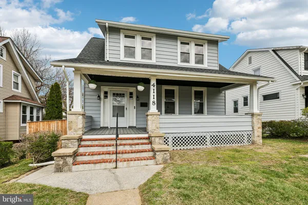 a front view of a house with a porch