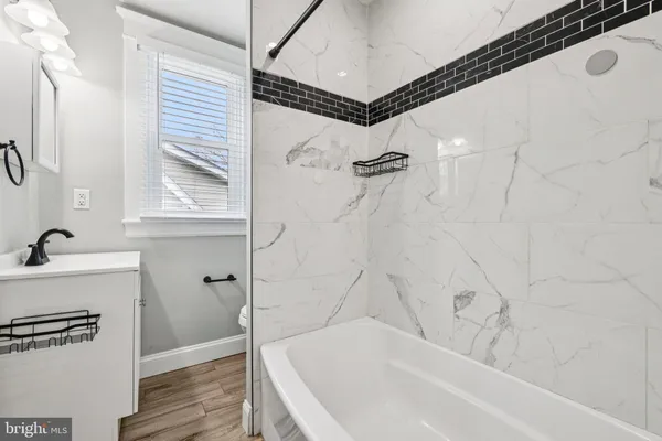 a bathroom with a sink and a window