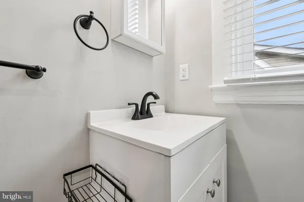 a bathroom with a toilet sink and shower