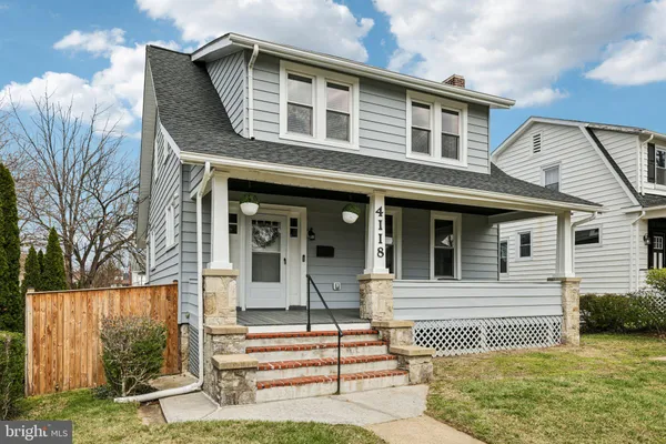 a front view of a house with a porch