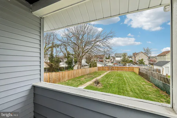 a view of yard with swimming pool and green space