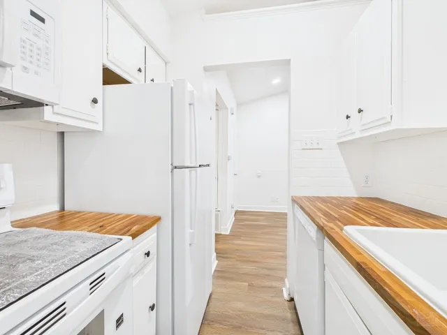 a view of a kitchen cabinets and wooden floor