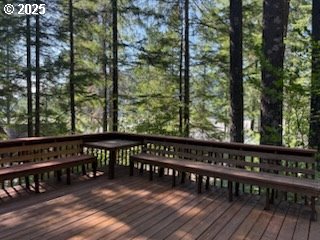 41 Northwoods Cougar, WA 98616 - Photo 28 of 33 a wooden deck with trees in front of it