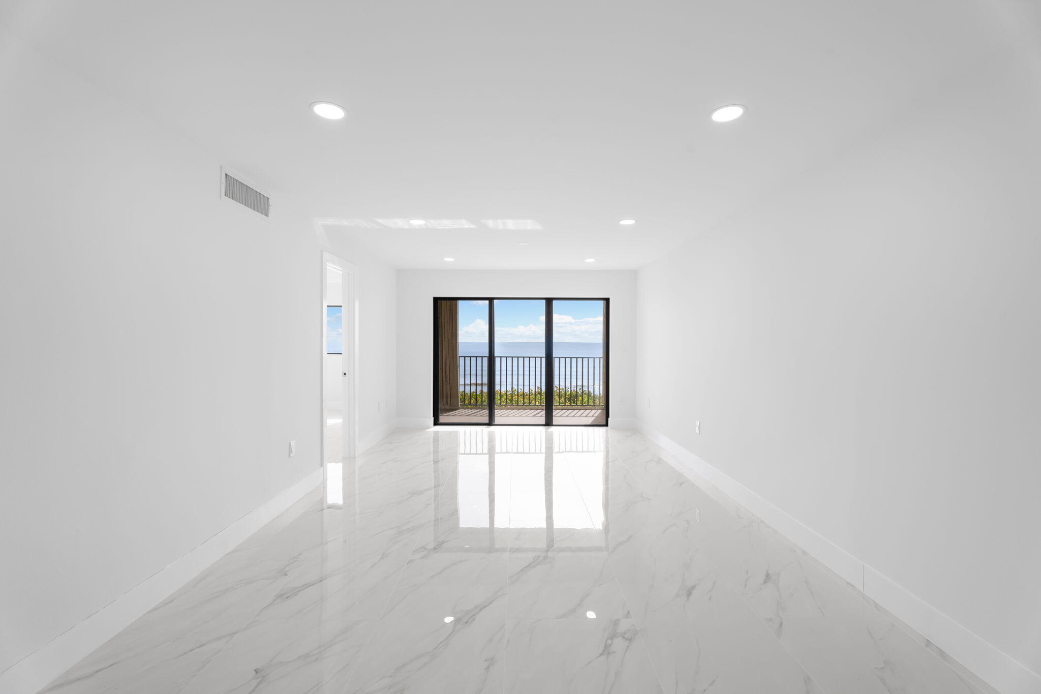 7420 South Ocean Drive, Unit 314 Jensen Beach, FL 34957 - Photo 11 of 24 an empty room with large windows