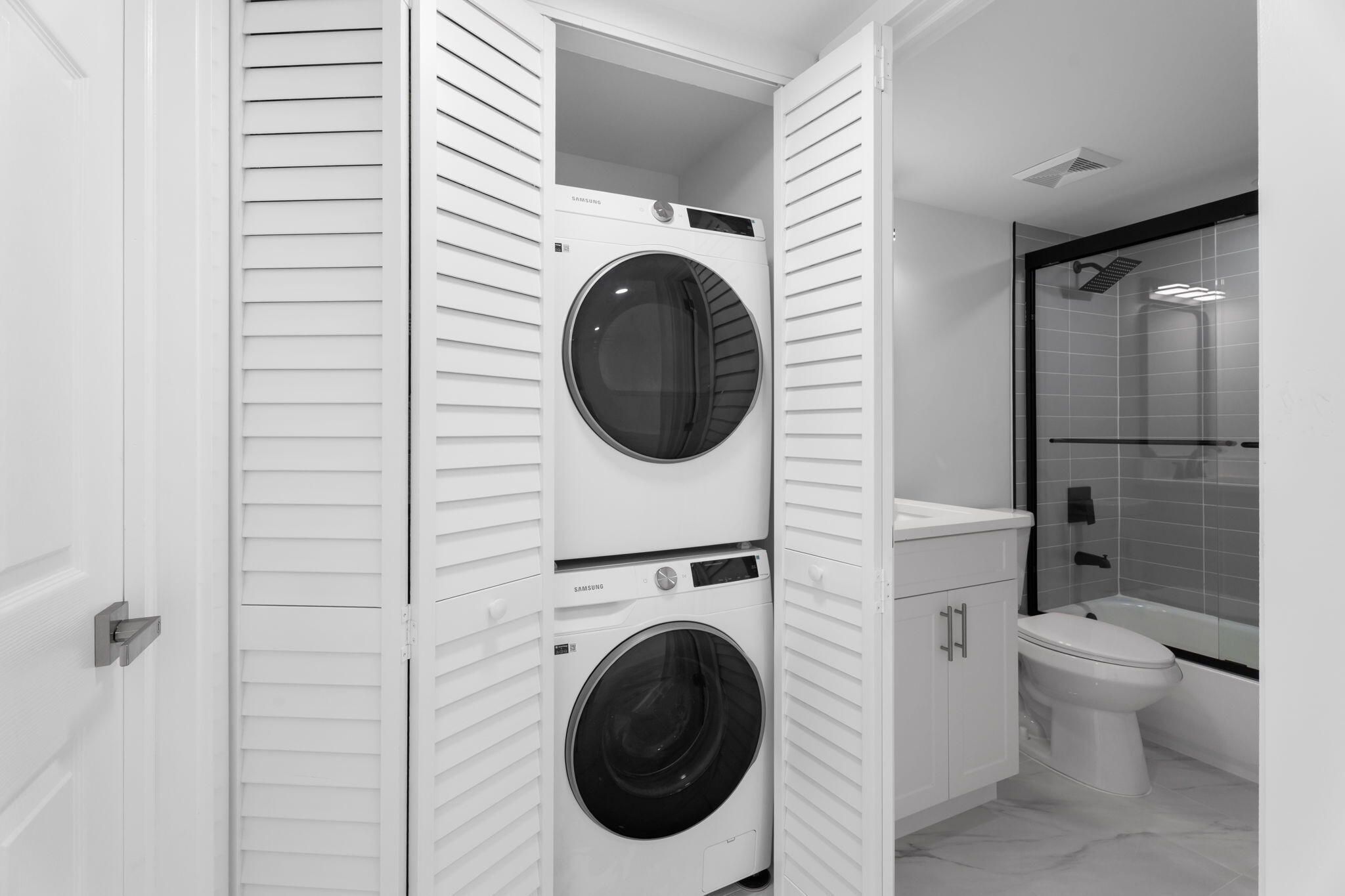 7420 South Ocean Drive, Unit 314 Jensen Beach, FL 34957 - Photo 13 of 24 a utility room with dryer and washer