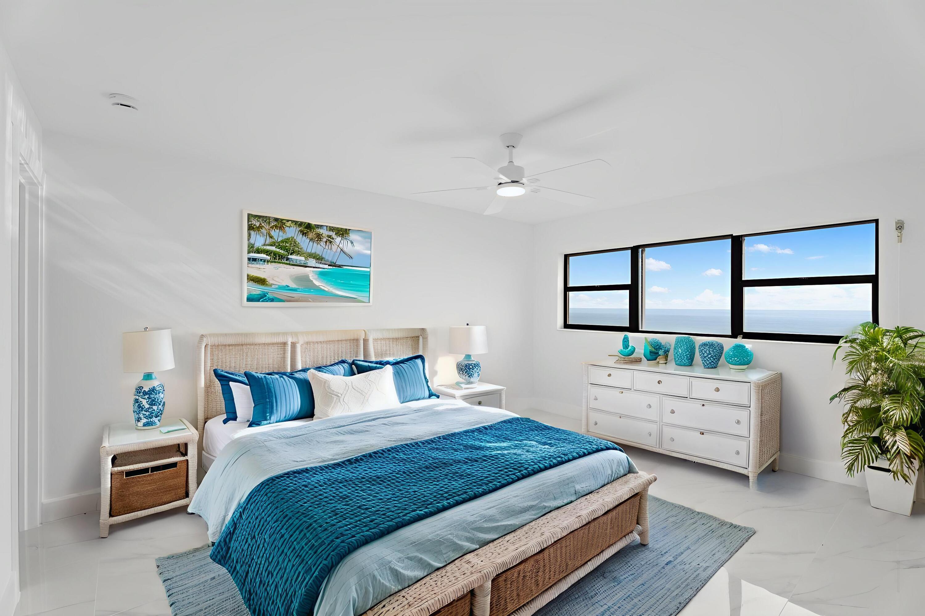 7420 South Ocean Drive, Unit 314 Jensen Beach, FL 34957 - Photo 20 of 24 a bedroom with a balcony a bed and a painting on the wall