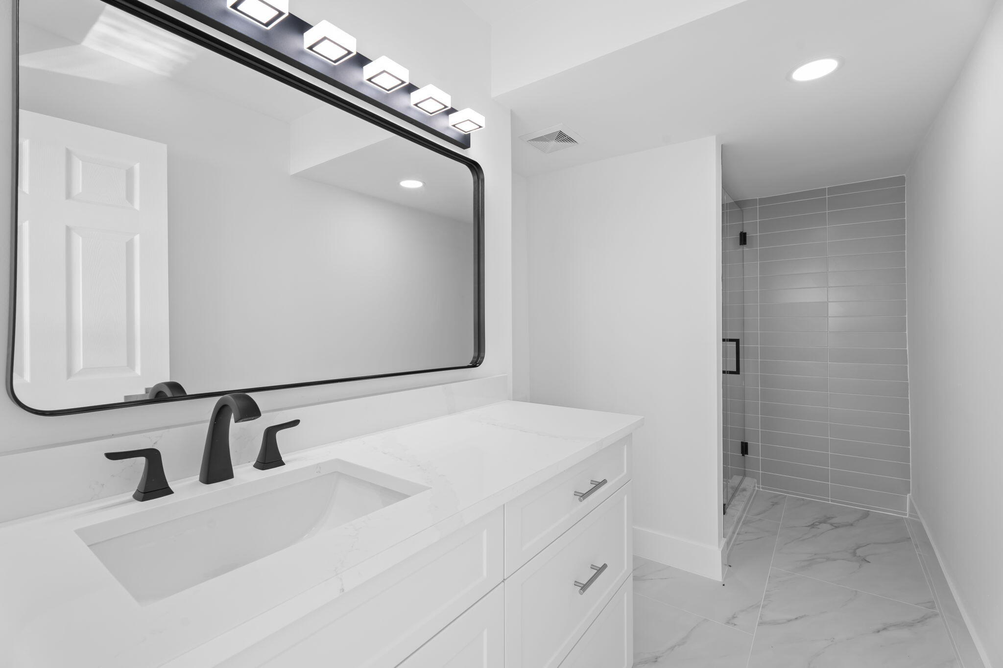 7420 South Ocean Drive, Unit 314 Jensen Beach, FL 34957 - Photo 21 of 24 a bathroom with a sink and mirror