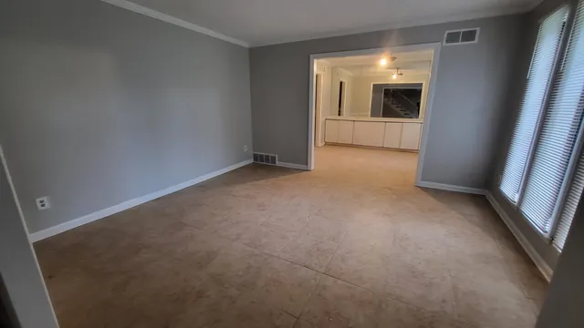 an empty room with windows