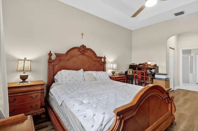 a en suite bathroom with a double vanity sink and a mirror