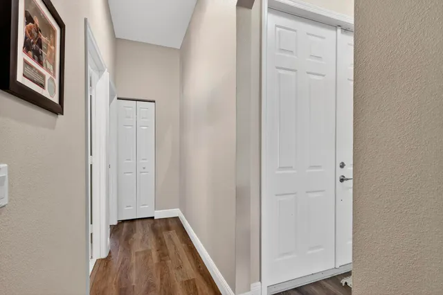 a front view of a house with swimming pool garden and patio