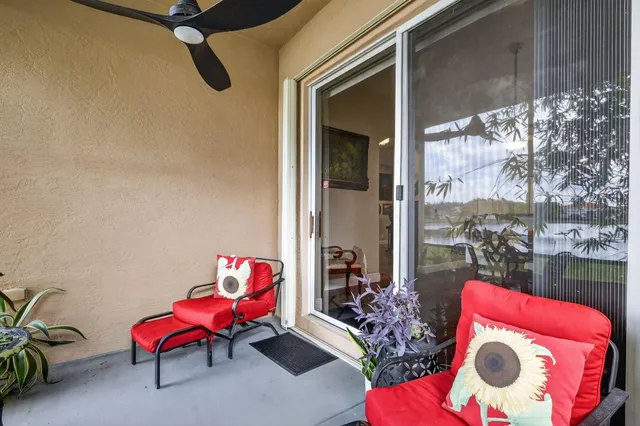 an aerial view of a residential houses with outdoor space and swimming pool