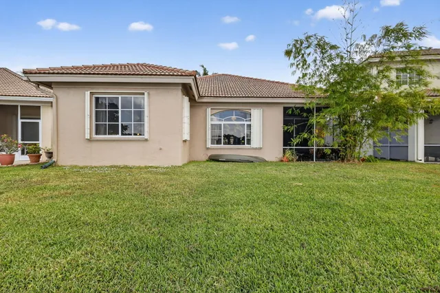 a view of a swimming pool with a lounge chair