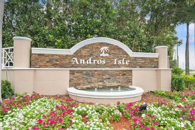 a living room with furniture pool table and a large window