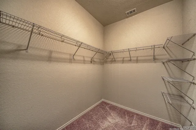 a view of small space with racks on the wall