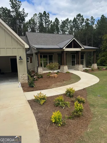 a front view of a house with yard