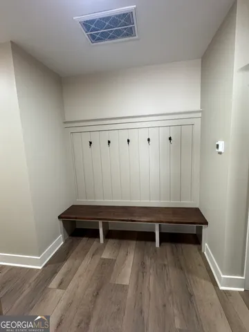 a view of room with wooden floor and chair