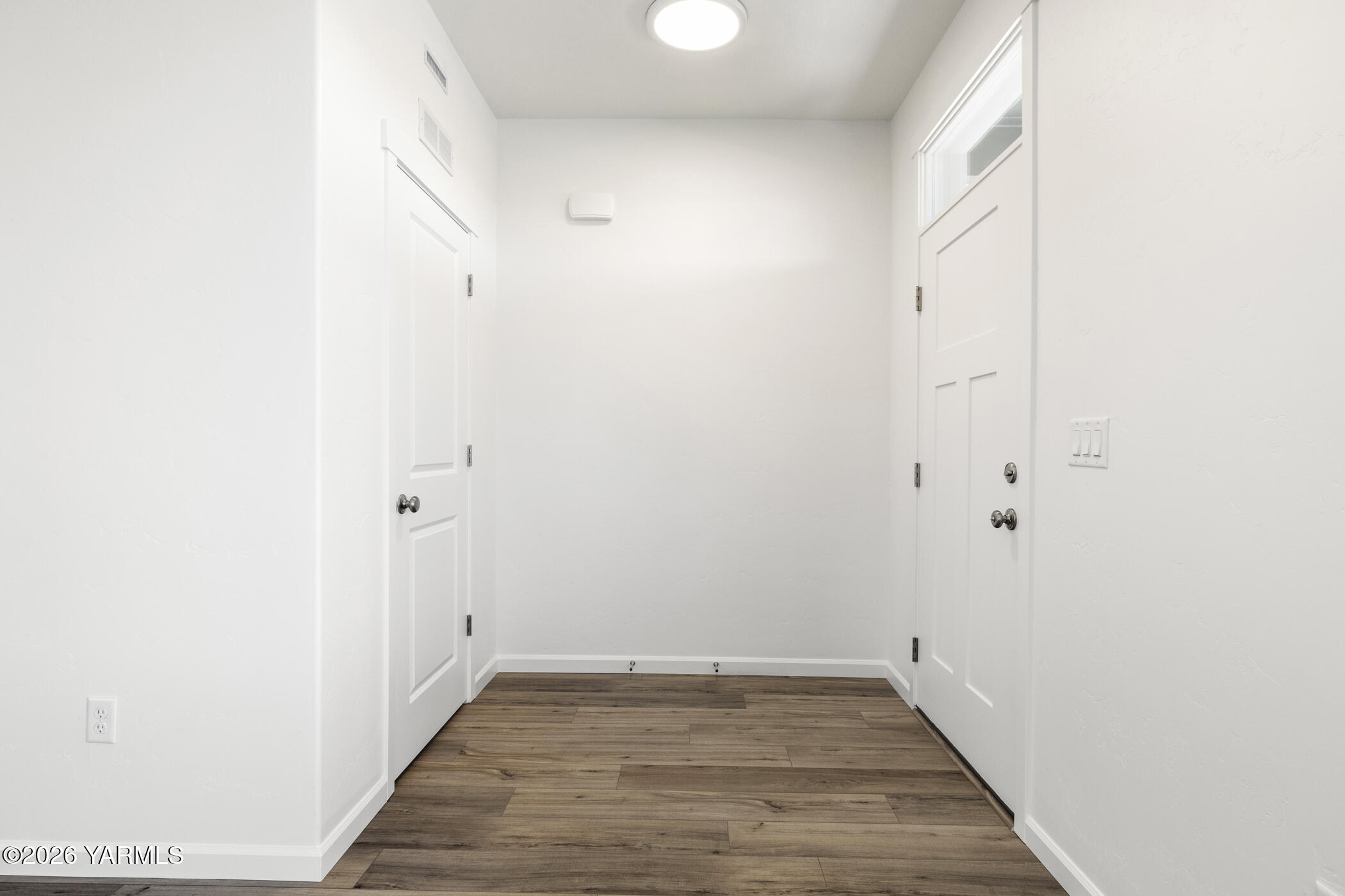 313 Amberly Avenue Grandview, WA 98930 - Photo 5 of 18 a view of a room with wooden floor