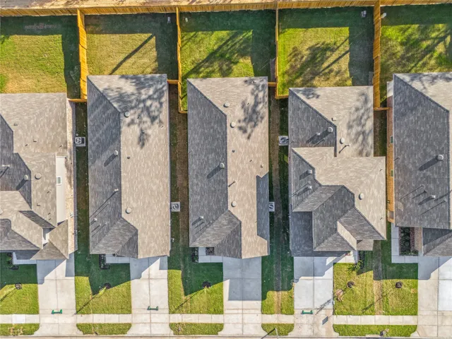 a view of a swimming pool with an outdoor seating and a yard