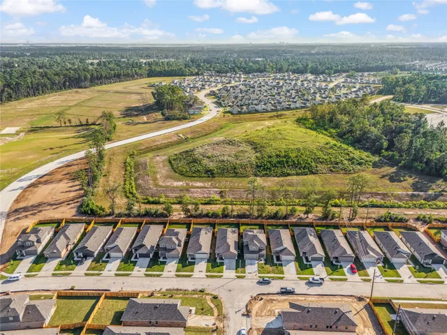 a view of a swimming pool with lawn chairs