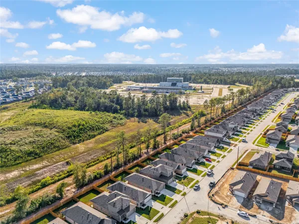 a view of a swimming pool with lawn chairs