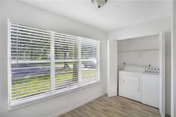 a view of a kitchen and a window