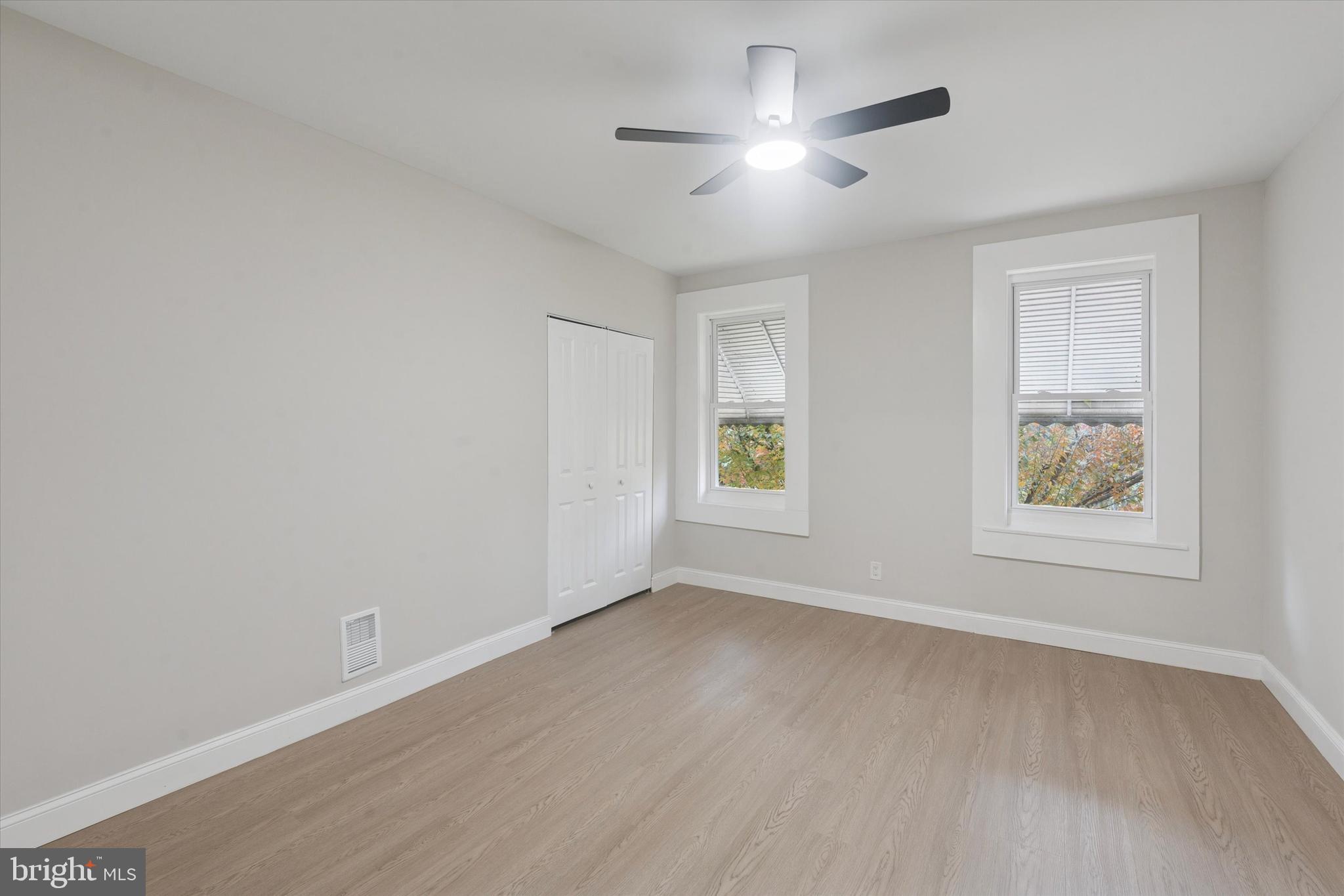 3047 Fontain Street Philadelphia, PA 19121 - Photo 11 of 15 a view of an empty room with a window and wooden floor