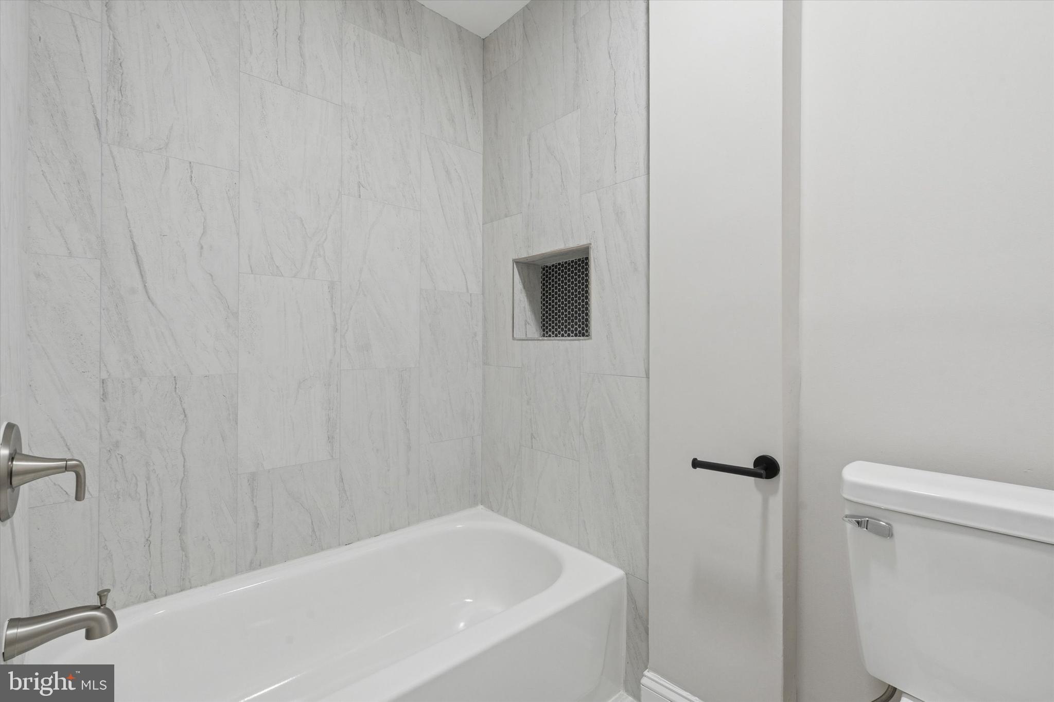 3047 Fontain Street Philadelphia, PA 19121 - Photo 13 of 15 a bathroom with a bathtub