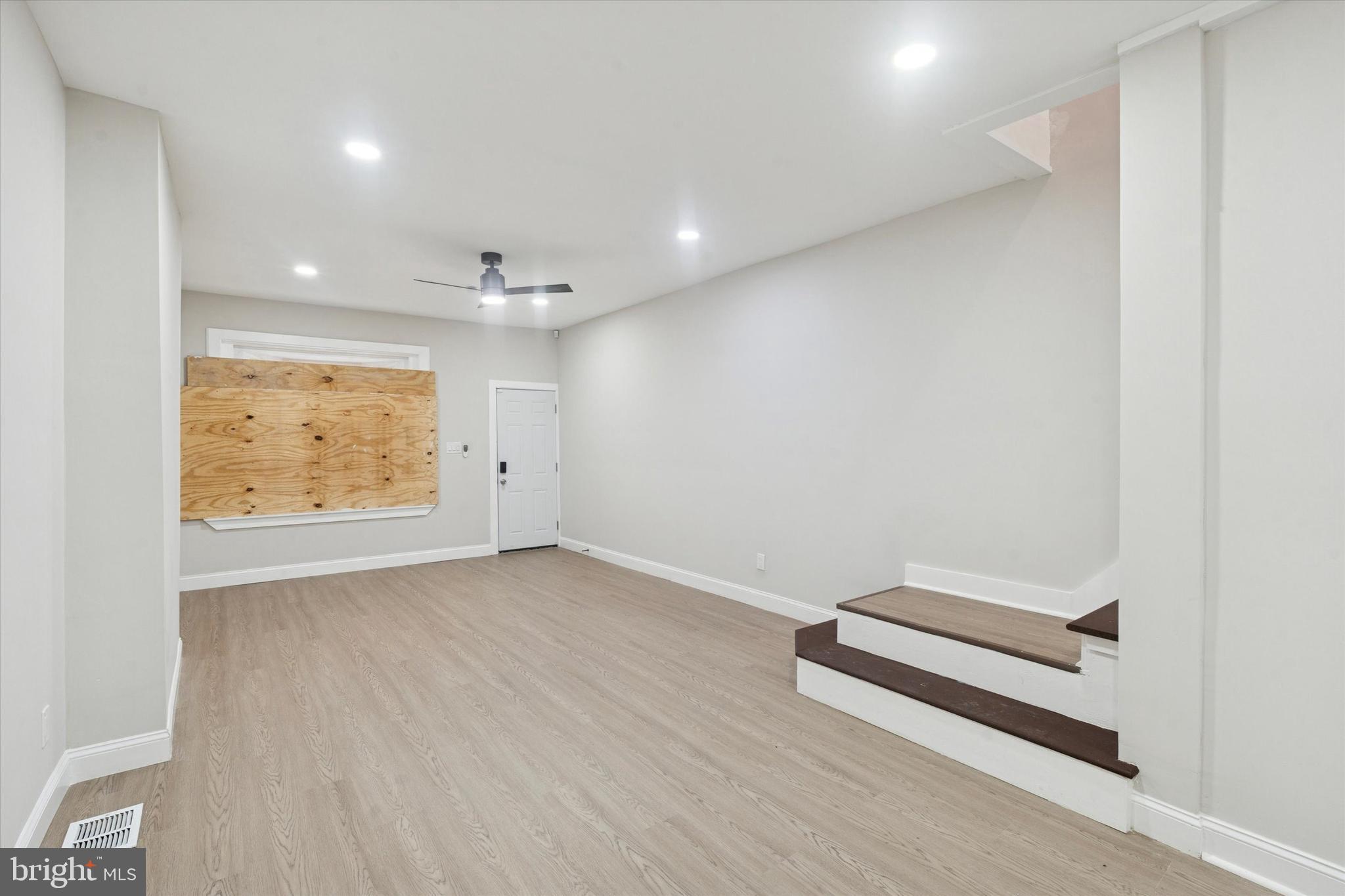 3047 Fontain Street Philadelphia, PA 19121 - Photo 15 of 15 an empty room with wooden floor and window
