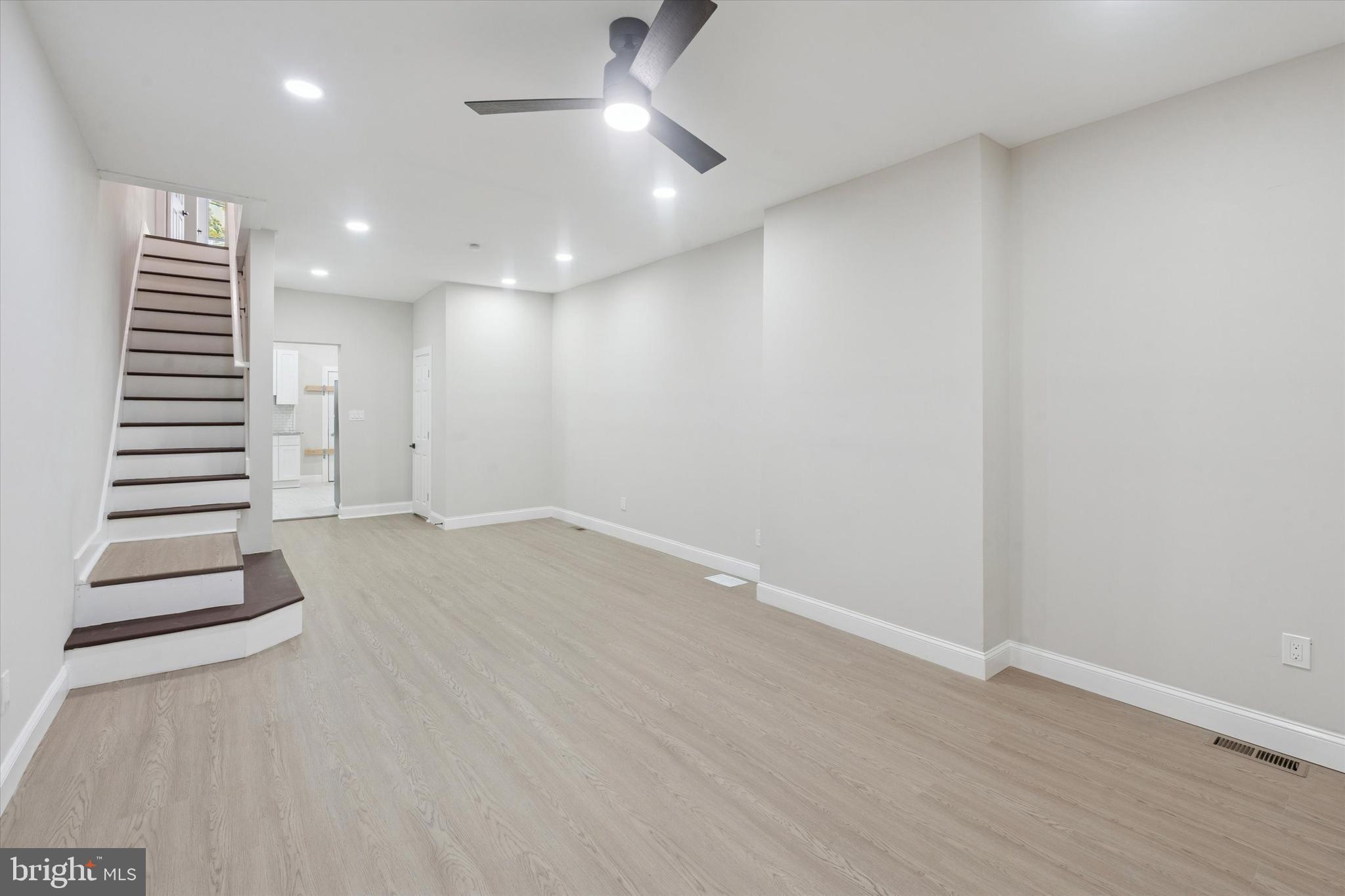 3047 Fontain Street Philadelphia, PA 19121 - Photo 5 of 15 an empty room with a hallway and stairs