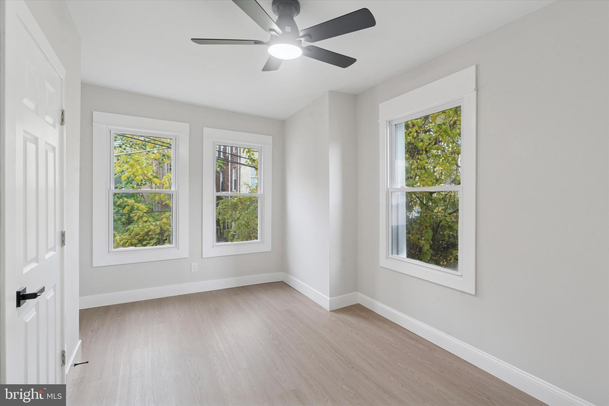3047 Fontain Street Philadelphia, PA 19121 - Photo 6 of 15 a view of an empty room with a window and wooden floor