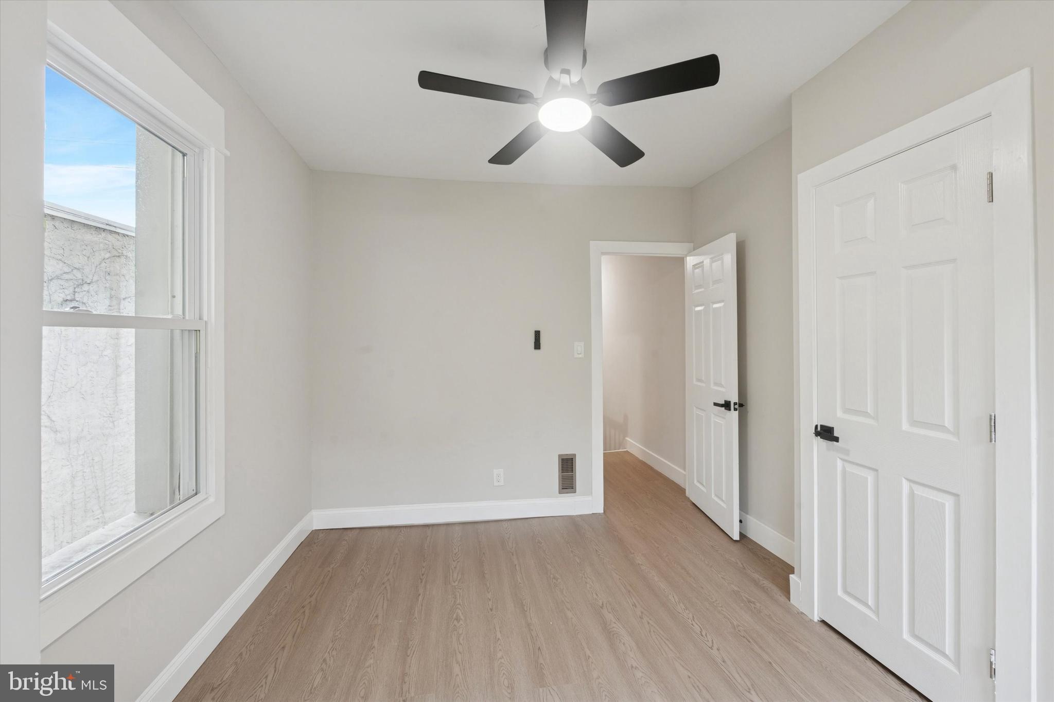 3047 Fontain Street Philadelphia, PA 19121 - Photo 8 of 15 a view of empty room with wooden floor and fan