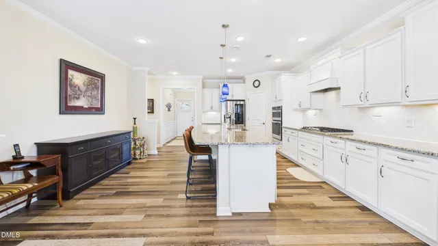 a kitchen with stainless steel appliances granite countertop a stove and a sink