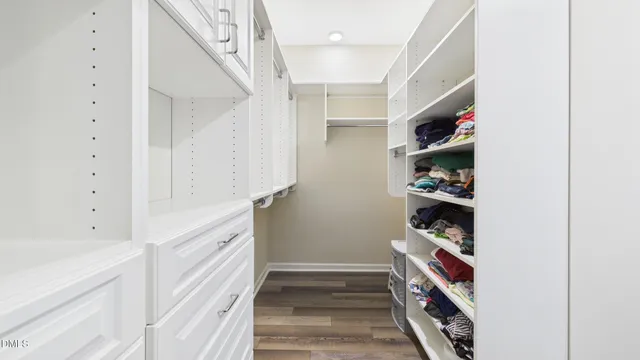 a bedroom with a bed and a television