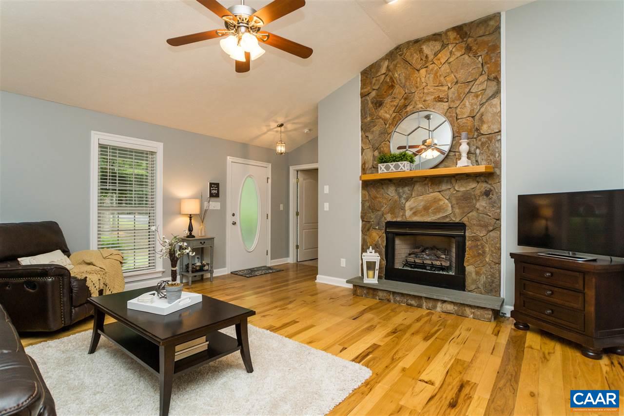 Magnificent Stone Fireplace extends floor to ceiling with concrete hearth, just AWESOME!