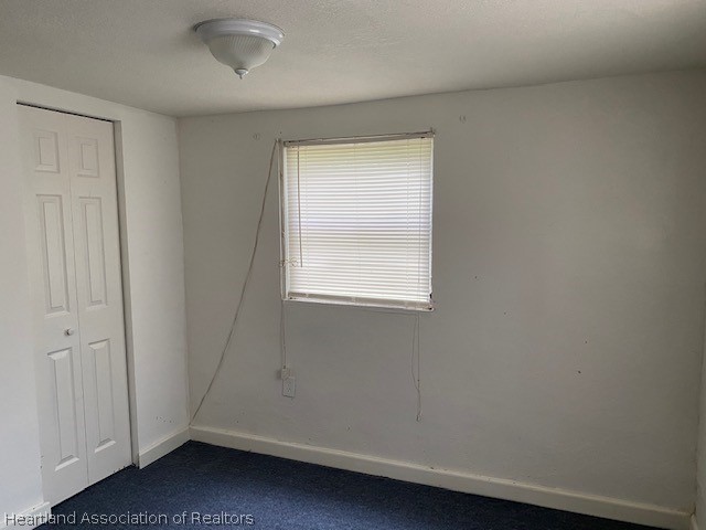 951 Lake June Road Lake Placid, FL 33852 - Photo 11 of 13 an empty room with a window
