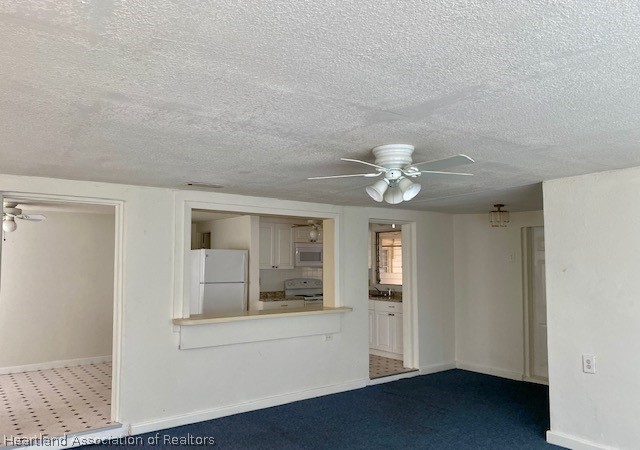 951 Lake June Road Lake Placid, FL 33852 - Photo 5 of 13 a view of an empty room with chandelier fan and fire place