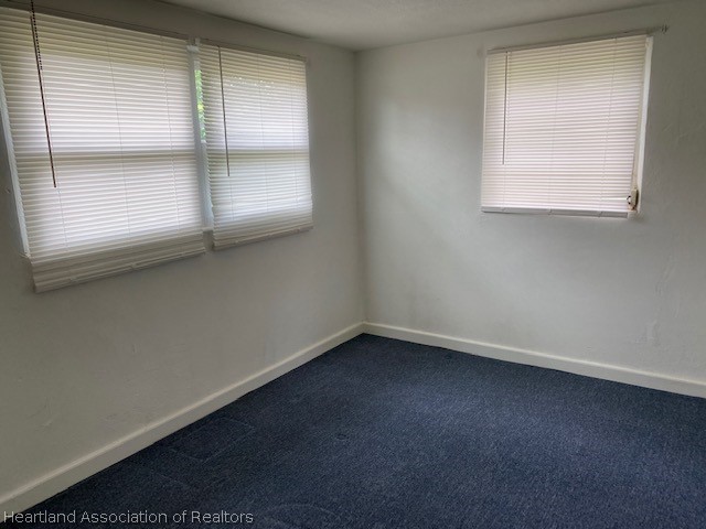 951 Lake June Road Lake Placid, FL 33852 - Photo 9 of 13 an empty room with a window
