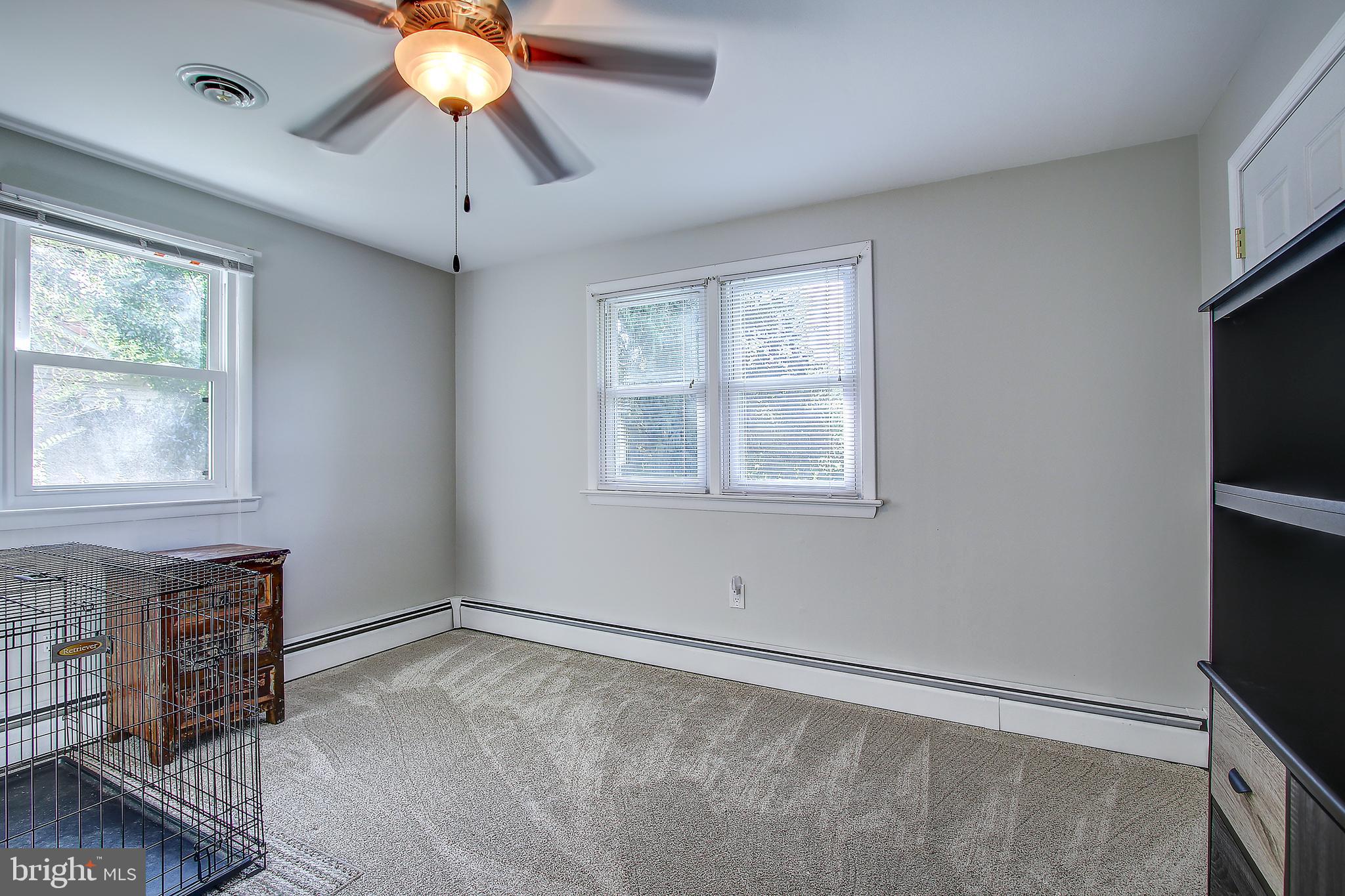 13846 Penn Shop Road Mount Airy, MD 21771 - Photo 22 of 42 a view of an empty room with window and chandelier fan