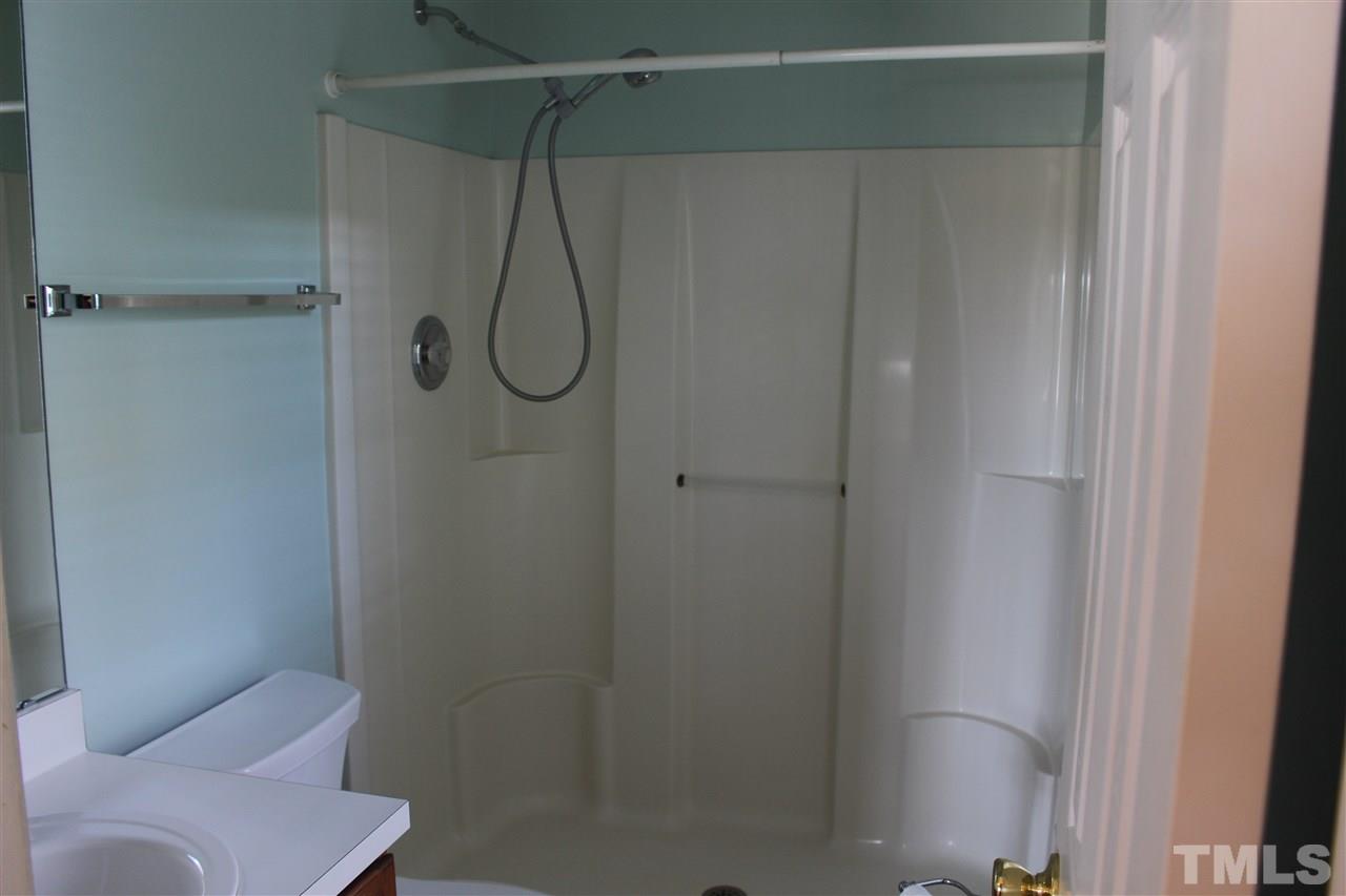 5002 Gable Ridge Drive Durham, NC 27713 - Photo 14 of 16 a bathroom with a shower