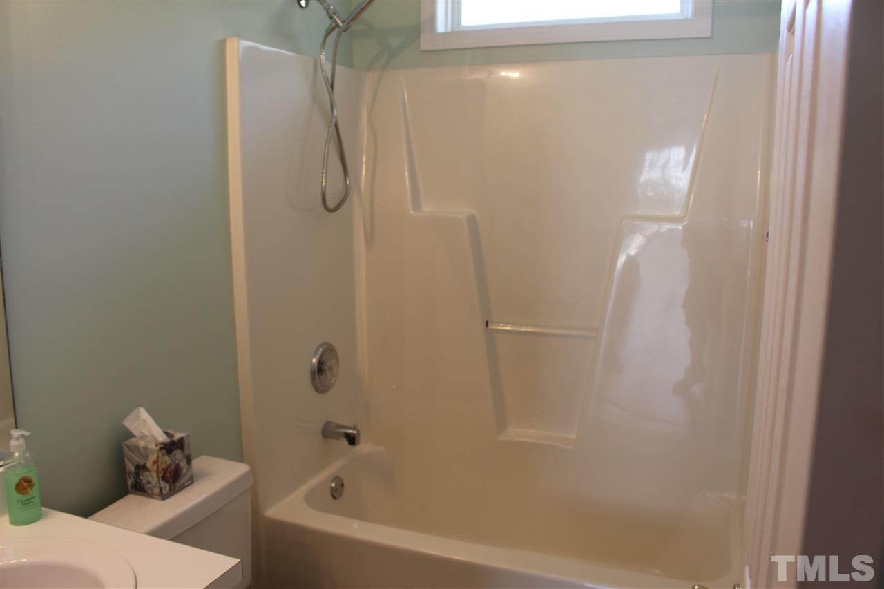 5002 Gable Ridge Drive Durham, NC 27713 - Photo 8 of 16 a bathroom with a bathtub and shower
