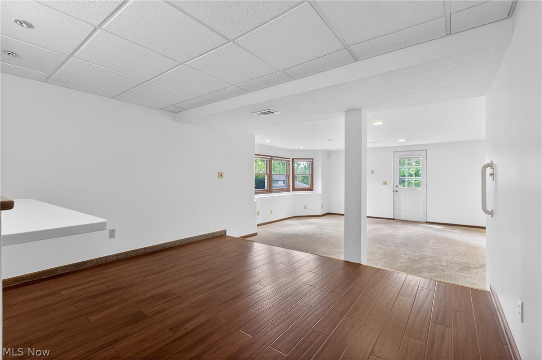 5346 Burlawn Street Northwest Canton, OH 44708 - Photo 27 of 40 Expansive lower-level space featuring rich wood-finish flooring, recessed lighting, and a white drop ceiling
